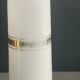 Pair of porcelain candlesticks with a gold pattern.