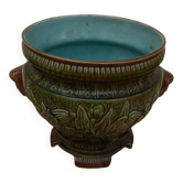 Old earthenware cachepot with woman decoration