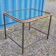 Table with an old ship porthole in brass and a metal base / 100 x 85 x 76 cm