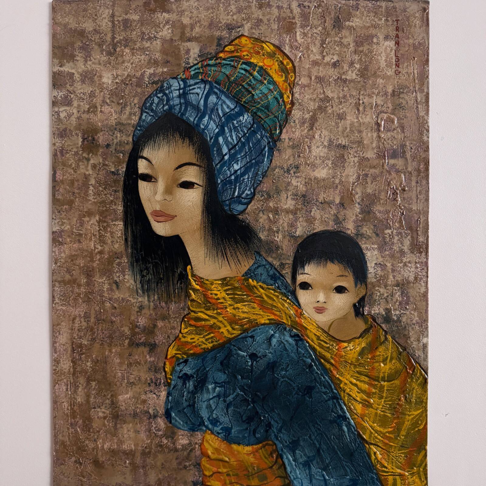 Acrylic on cardboard by Tran Long a mother carrying her child