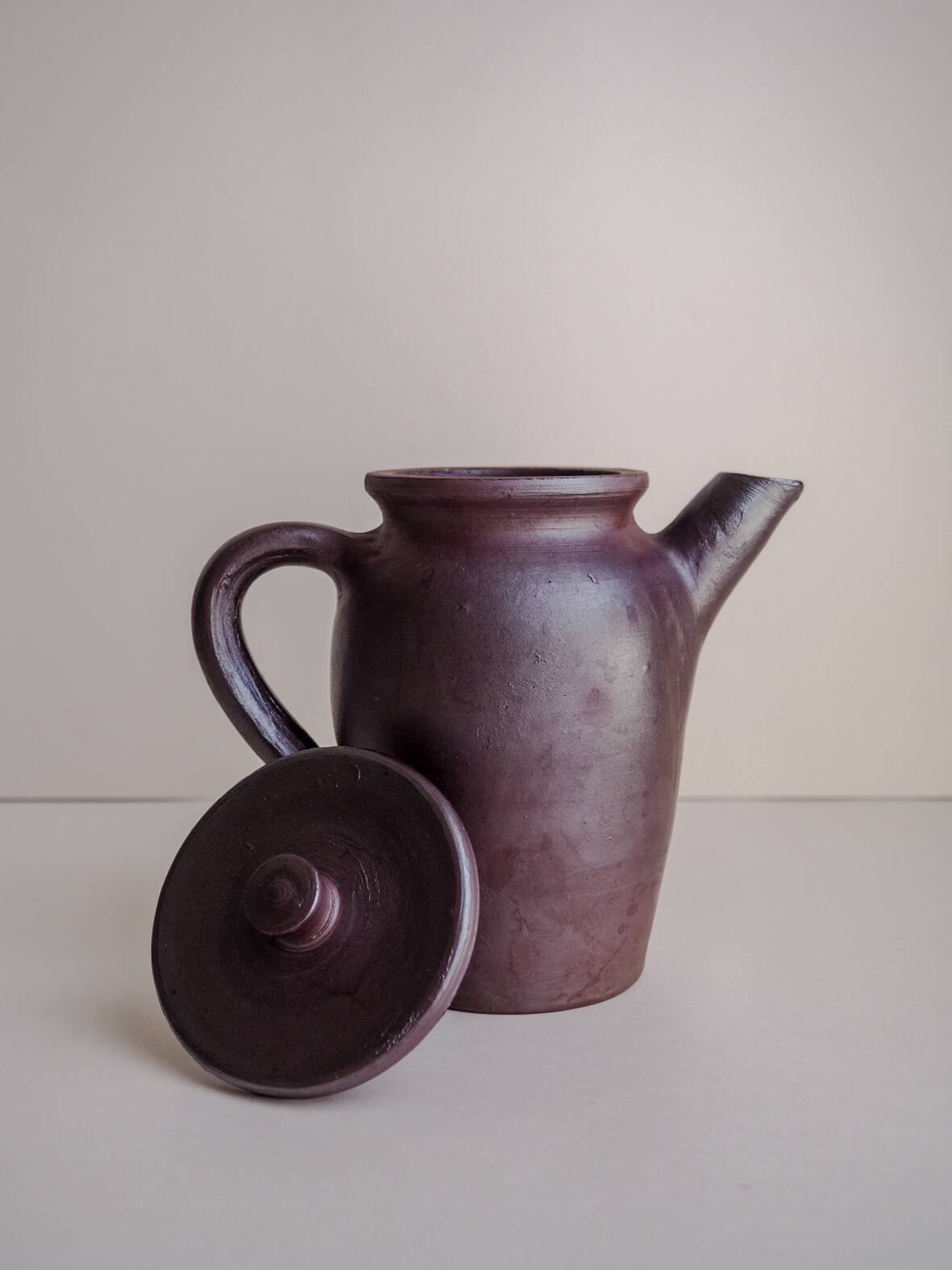 Brown ceramic artisan coffee maker