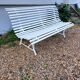 Old garden bench with metal legs and wooden slats