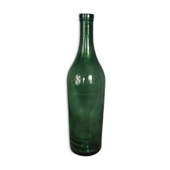 Old bottle in bubbled glass