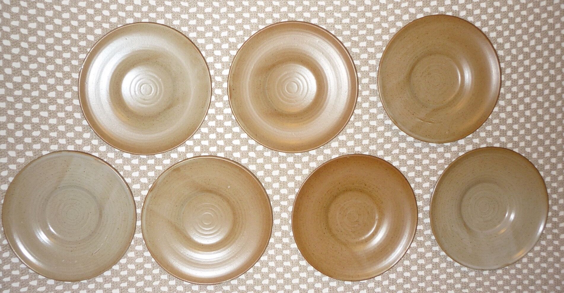 Pair of CNP Village France stoneware saucers