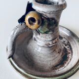 Ceramic candle holder with flower decor