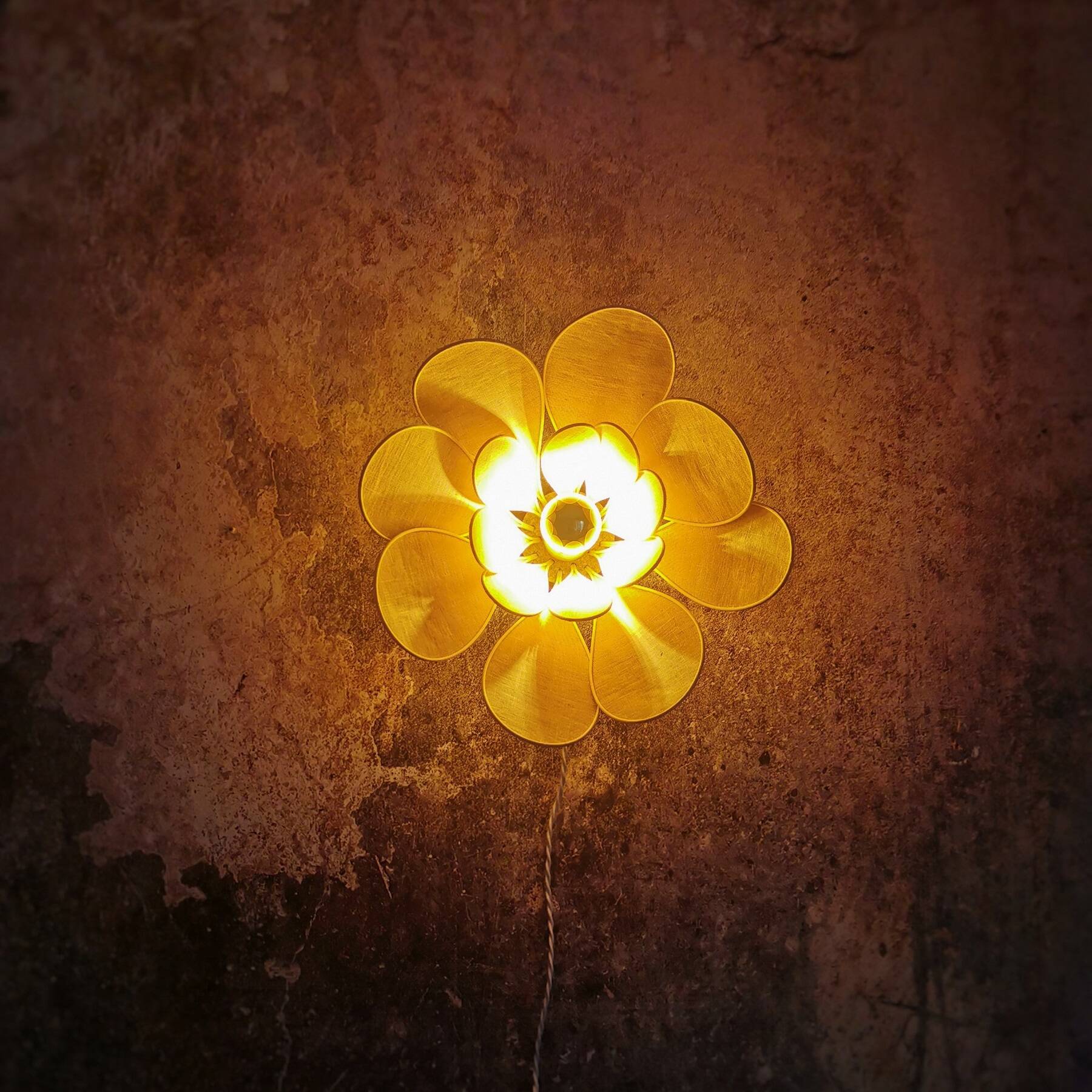 Flower wall light made of rattan and old pink linen petals