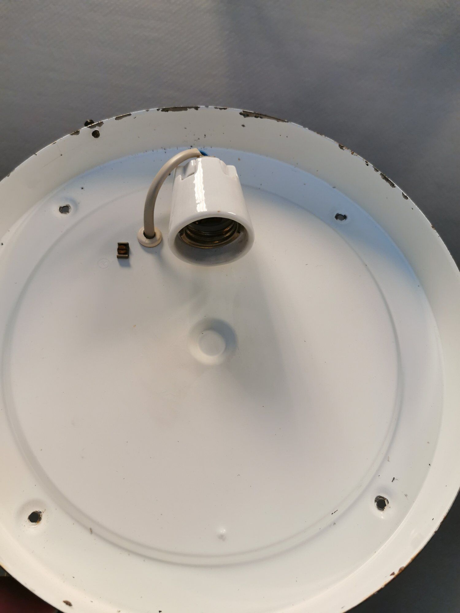 Ceiling light, in dark metallic paint with thick glass shade with beautiful details in the glass.