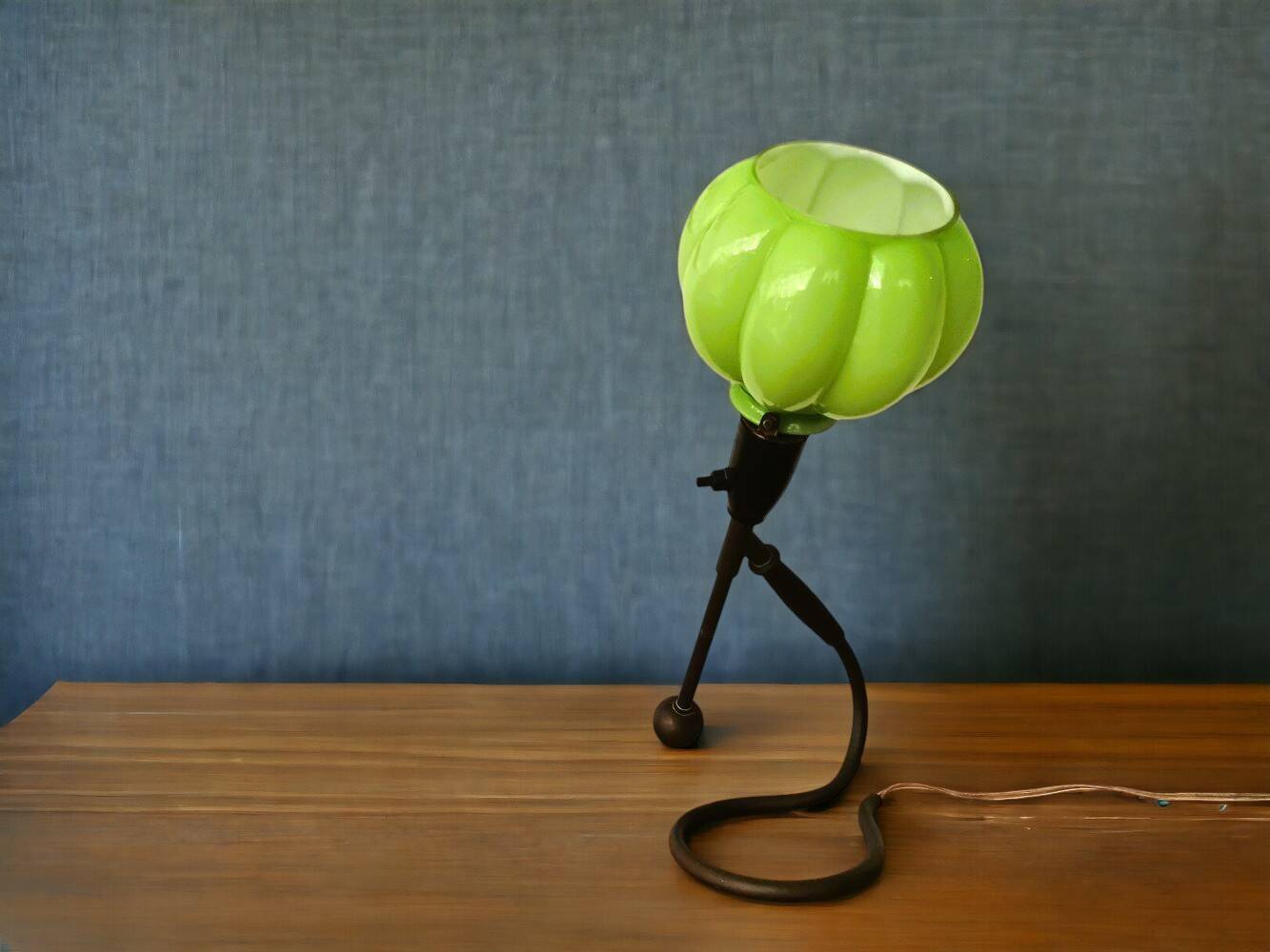 Modernist green cased glass and brass articulated table lamp