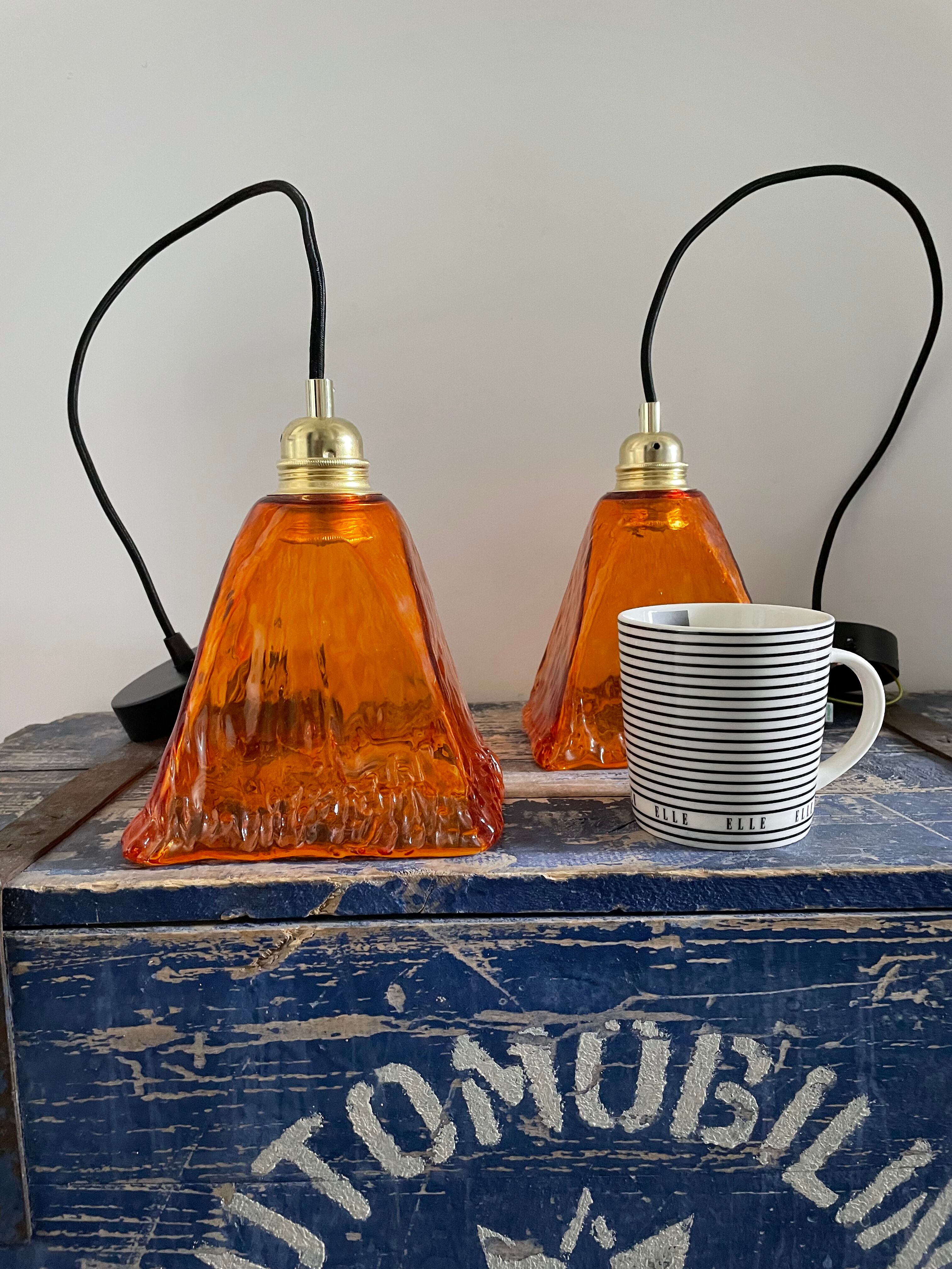 Set of two amber glass hanging lamps