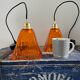 Set of two amber glass hanging lamps