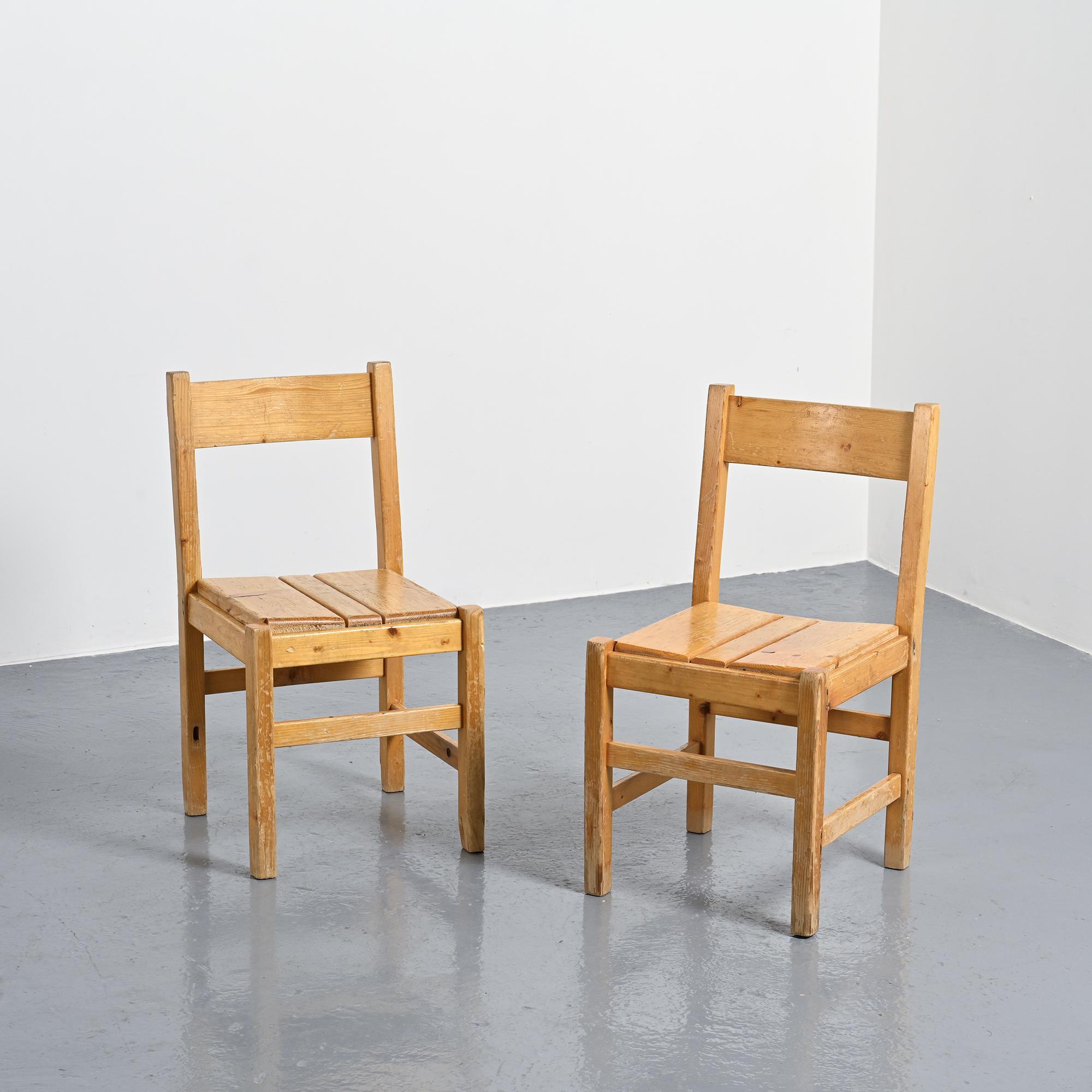 Pair of pine chairs, Maison Regain, France, circa 1970.