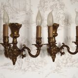 Pair of French baroque brass wall sconces with two branches, decorated with acanthus and wickerwork.