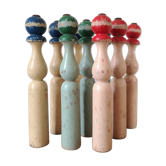 Serie de 9 quilles anciennes en bois peint