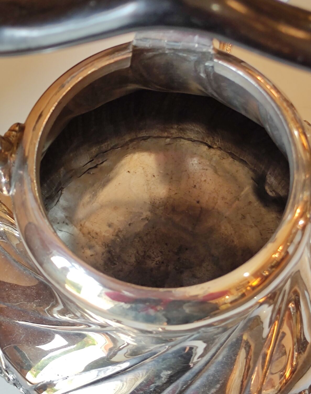 Ancient samovar tea fountain in silver metal