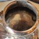 Ancient samovar tea fountain in silver metal