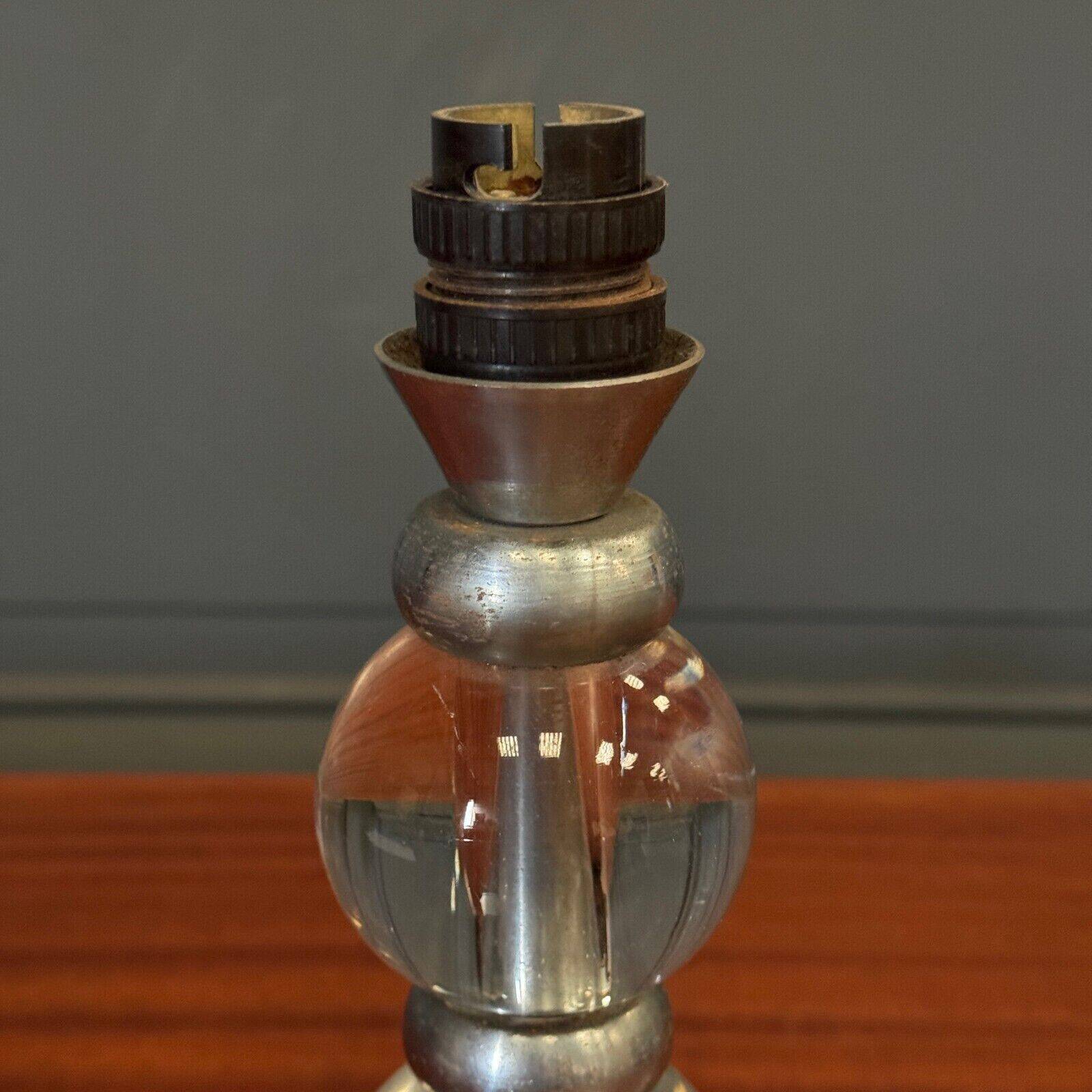 1950s lamp made up of two glass balls and a stainless steel base