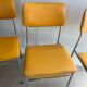 LM vintage chrome and orange/mustard yellow faux leather chairs