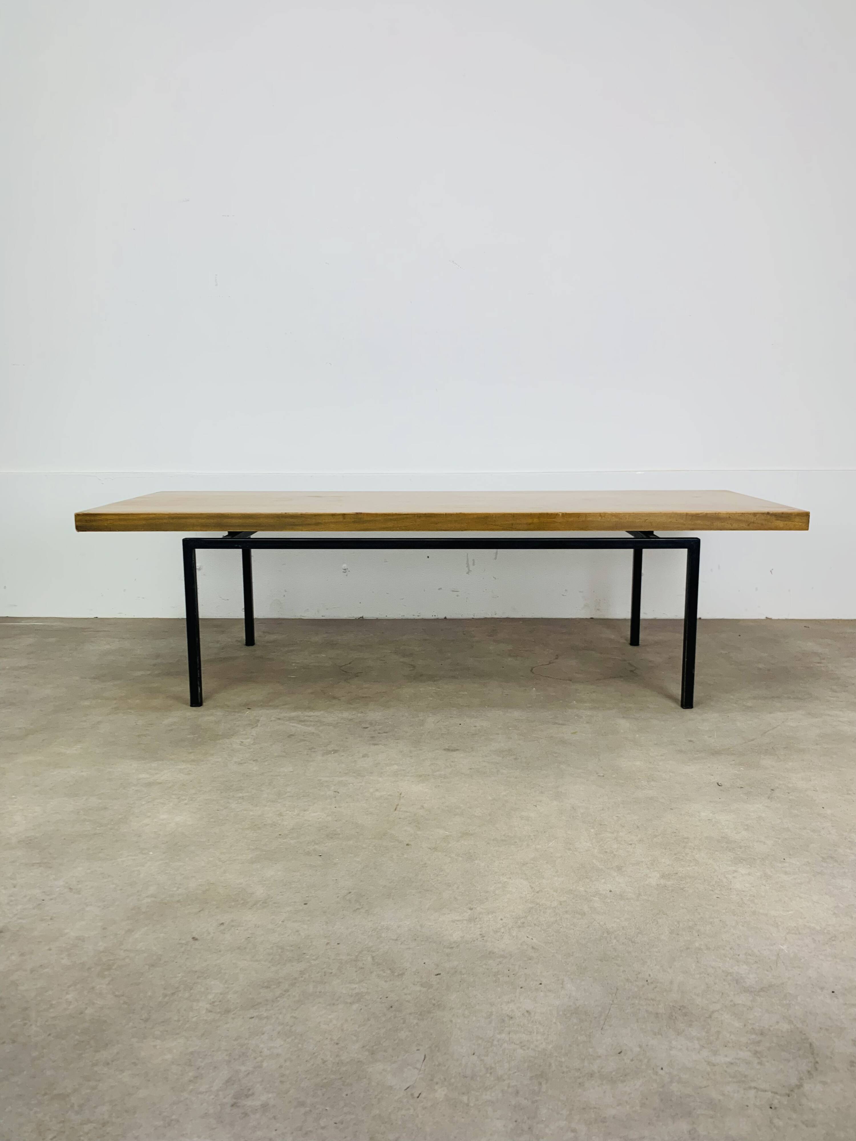 1950s modernist coffee table, wood and black metal.