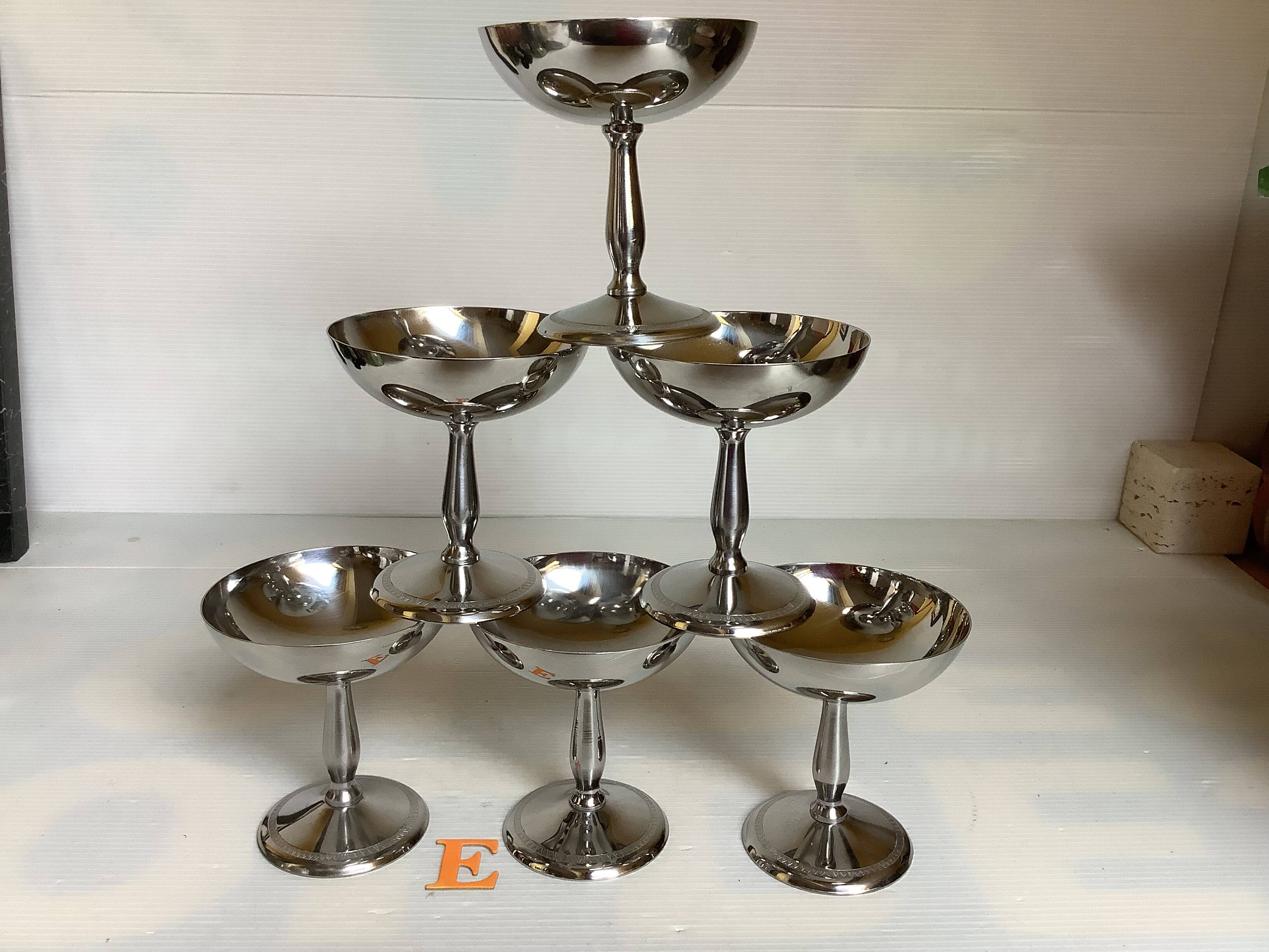 6 footed bowls with silver frieze in metal for ice.