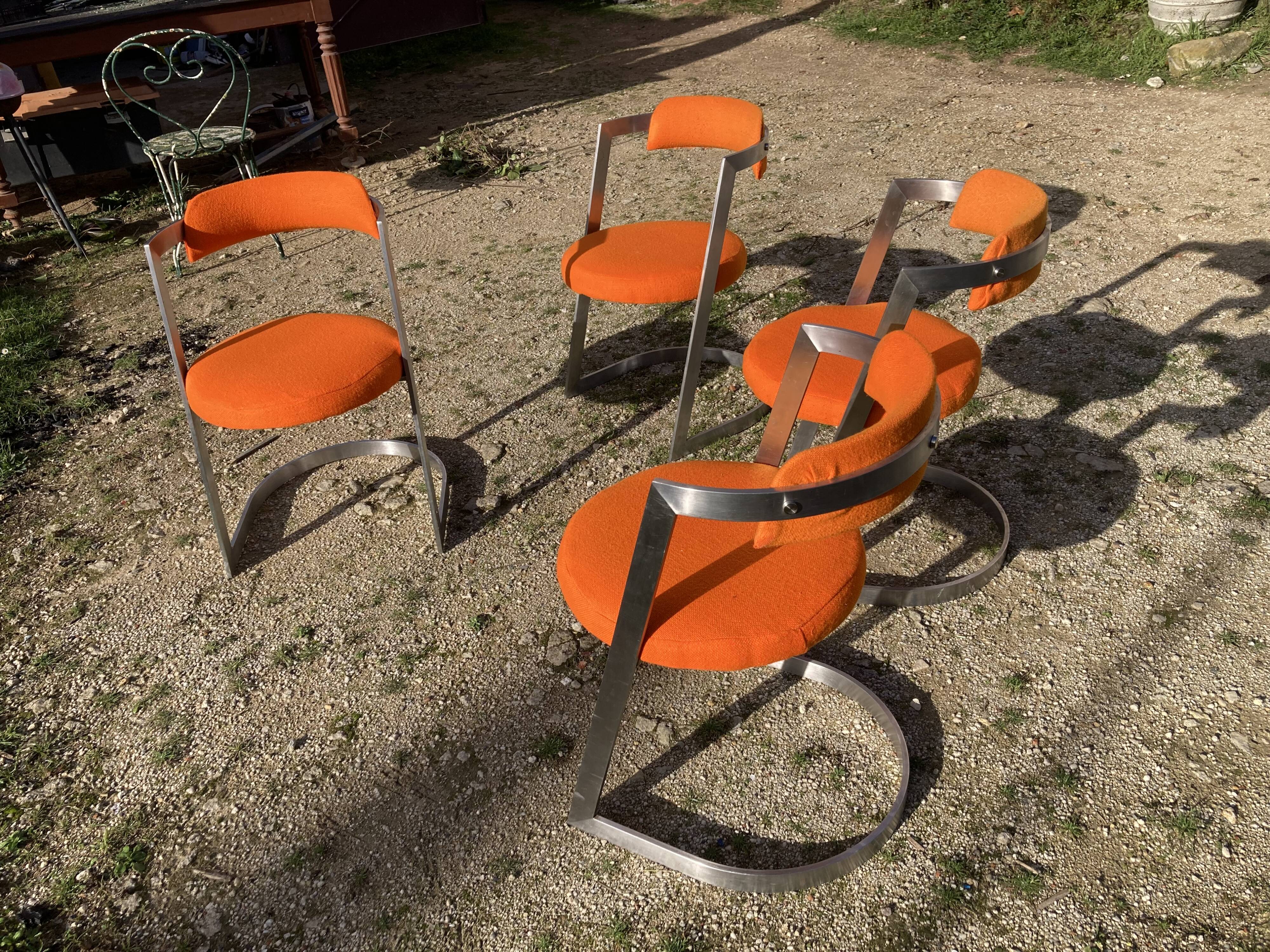 Four stainless steel armchairs from the 70s