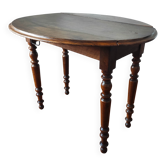 Antique drop-leaf table in solid walnut.