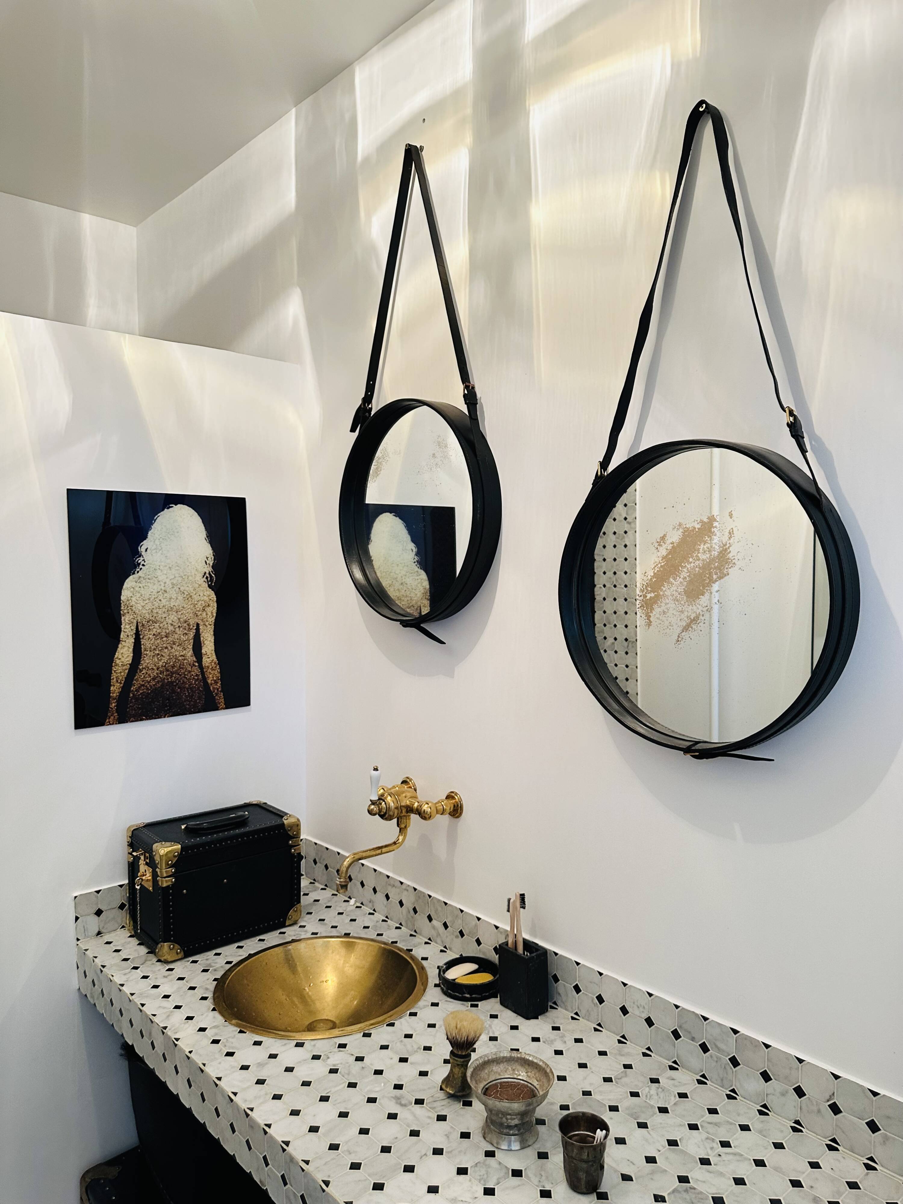 Jacques Adnet pair of circular leather and brass mirrors
