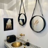 Jacques Adnet pair of circular leather and brass mirrors