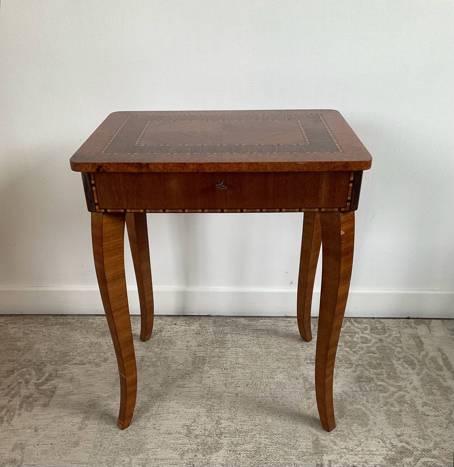 Small marquetry pedestal table with key storage