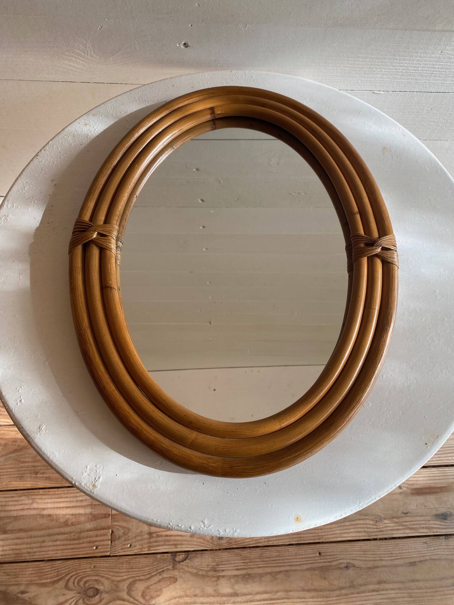Vintage oval rattan mirror