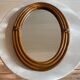 Vintage oval rattan mirror