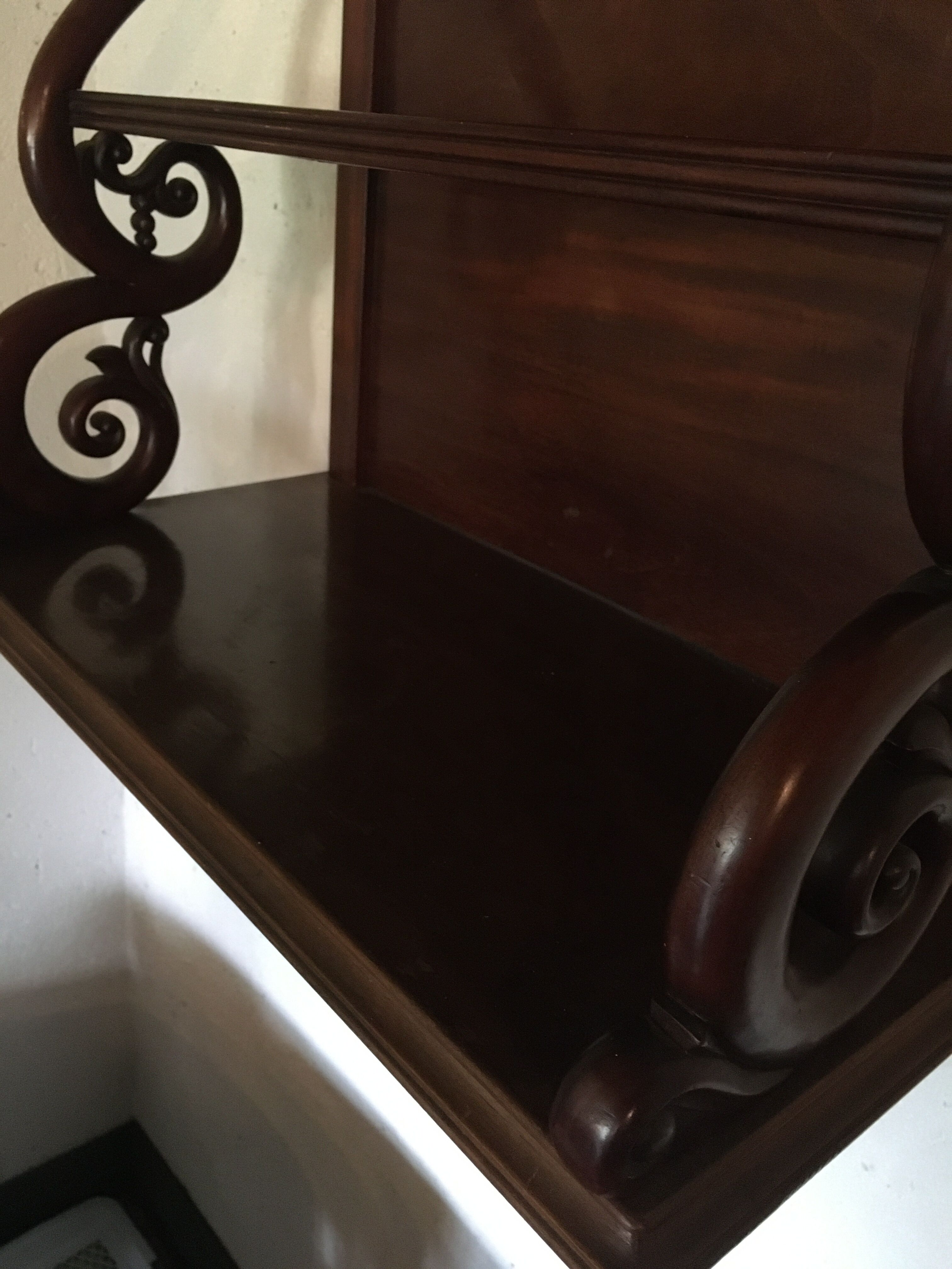 Carved wooden wall shelf.