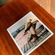 ⸻  Vintage Color Photograph from 1973 – Shoes on Wooden Deck
