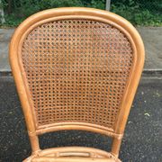 2 rattan and caned chairs in colonial bistro style from the 1990s.