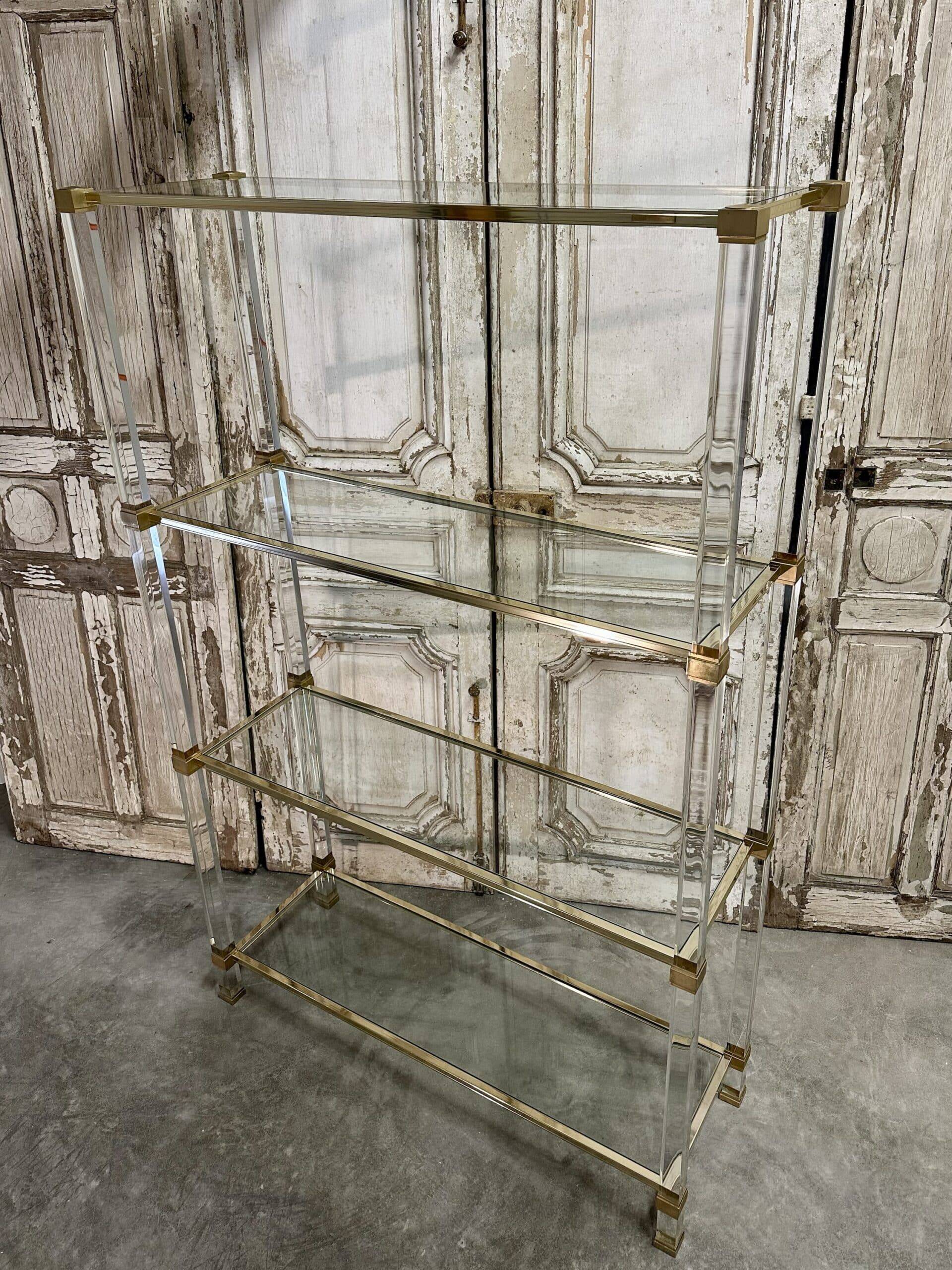 Plexiglass shelf by Pierre Vandel in Hollywood Regency style circa 1970.