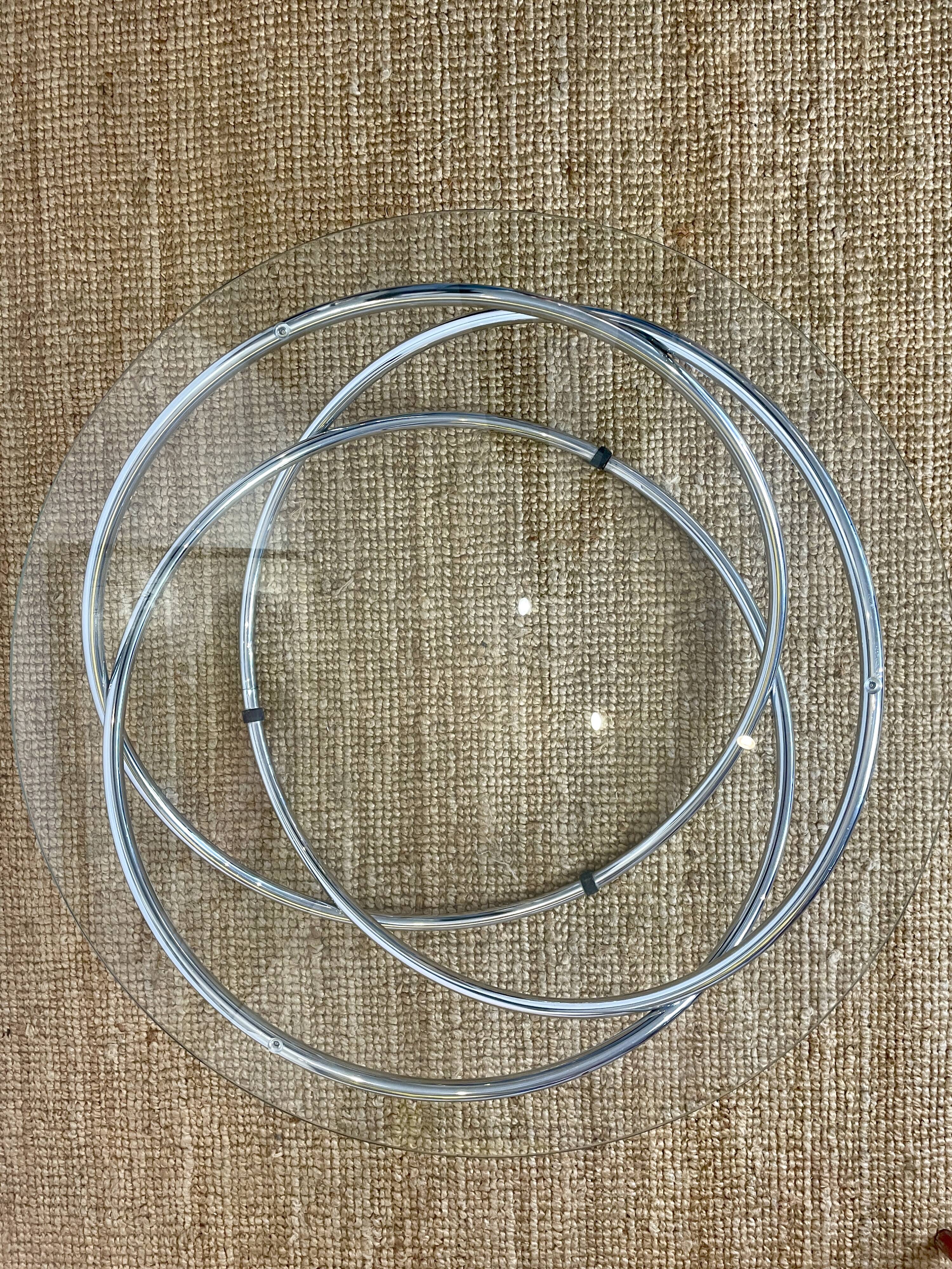 Coffee table with glass top and chrome tubular base