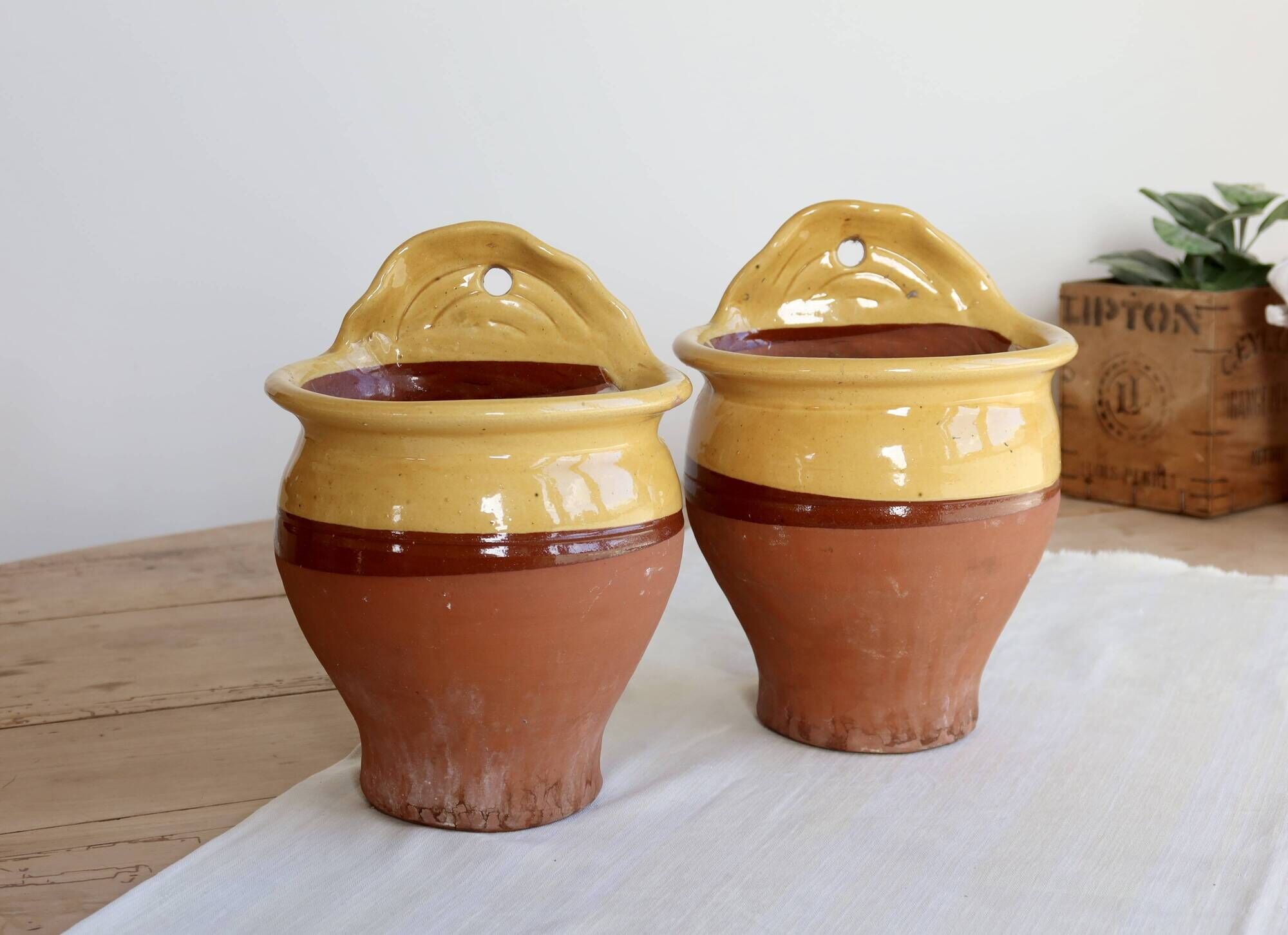 Pair of vintage wall planters in yellow glazed stoneware.