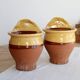 Pair of vintage wall planters in yellow glazed stoneware.