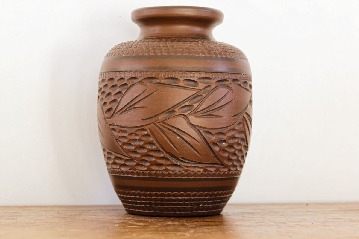 Carved terracotta vase, signed