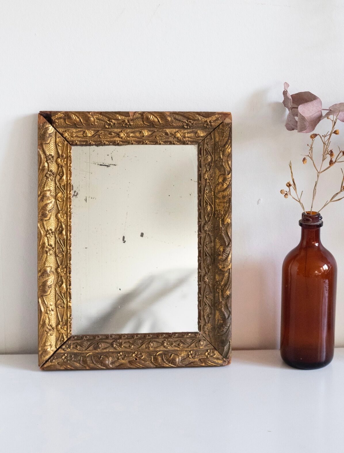 Antique mirror in gilded wood