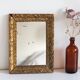 Antique mirror in gilded wood
