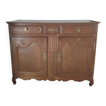 Two low antique buffets in carved solid oak with rosettes.