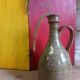 Vintage pottery in sandstone with handles and small beak