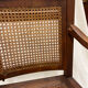 Caned armchair