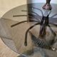 1970s modernist coffee table in smoked glass and metal.