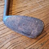 Wood, leather and metal golf club