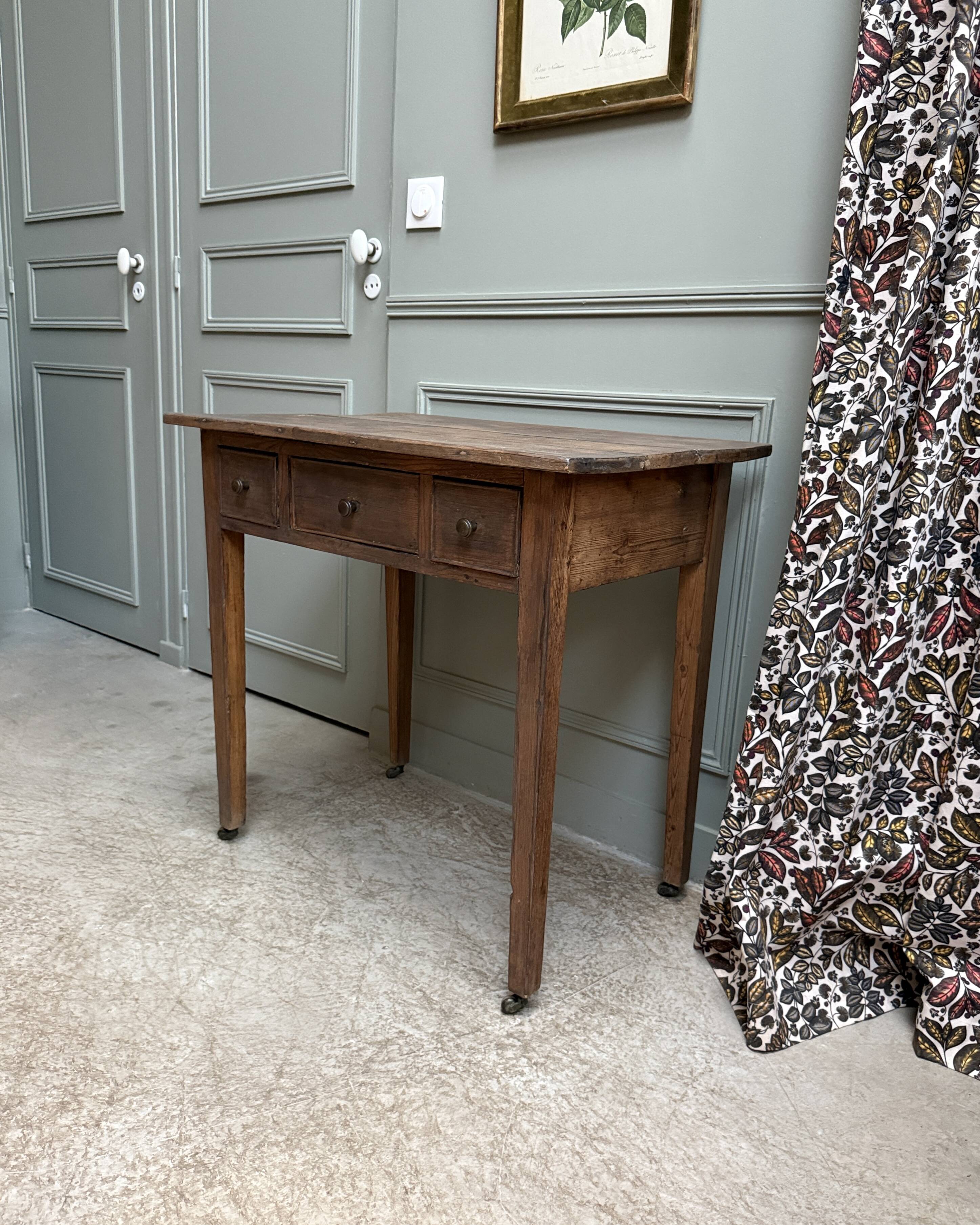 Small antique desk on wheels