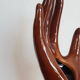 Hand wears brown jewelry , ring, soliflore , vintage French , 50s