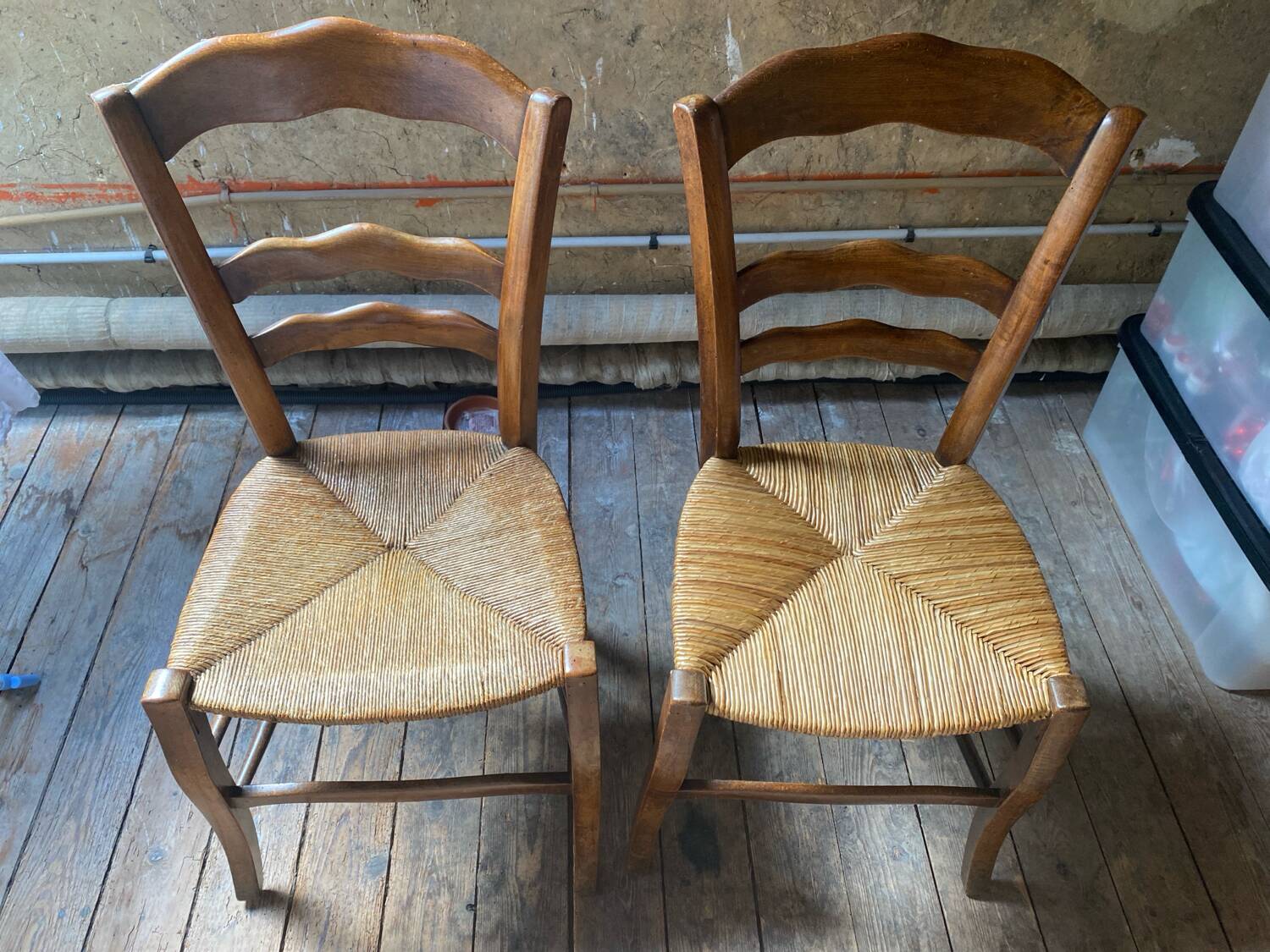 2 wooden chairs with cane