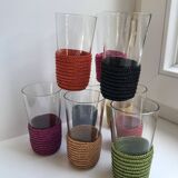 set of 9 small glasses with colored rattan support from the 70s
