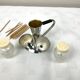 Vintage salt and pepper shakers and their chrome metal support